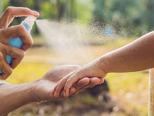 applying mosquito repellent