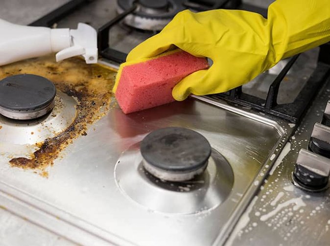 tucson homeowner deep cleaning kitchen stove